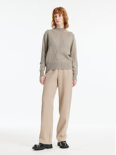 You can wear a pullover sweater with plaid pants.